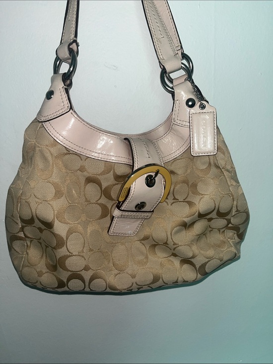 Coach Handbags - Coach Signature Soho Hobo bag featuring khaki monogram canvas and ivory leather